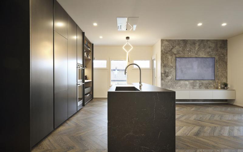 Dark kitchen with island and stoneware top in Vicenza