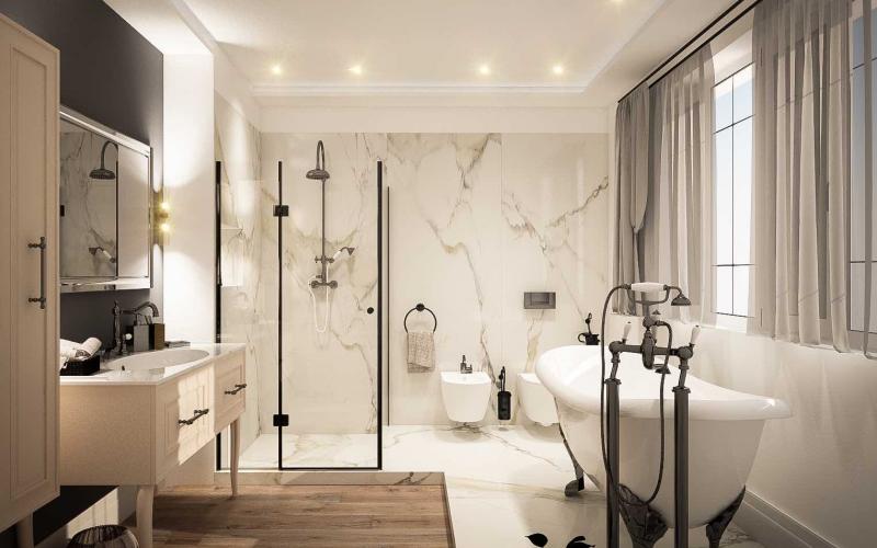 Progetto di bagno con grandi lastre in grès effetto marmo calacatta