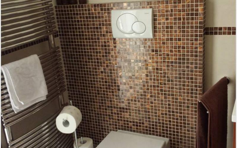 bathroom with bronze mosaic sanitary ware in vicenza