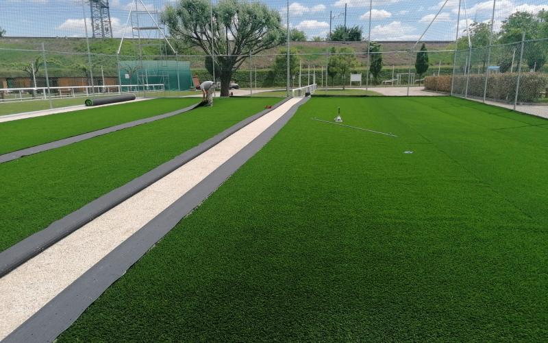 Synthetic grass: laying on a football pitch