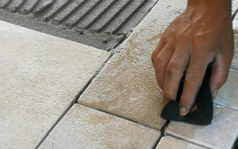 Laying tiles on an exterior of a house in Vicenza