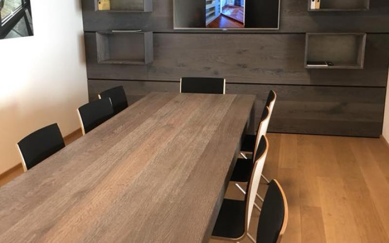 Meeting room with wooden wall and bookcase in Vicenza