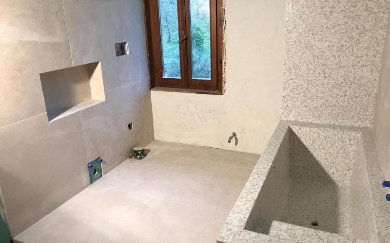 mosaic covering bathroom 
