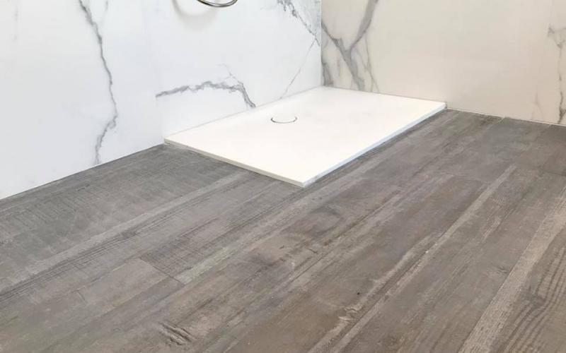 A white shower tray laid in a bathroom in Vicenza