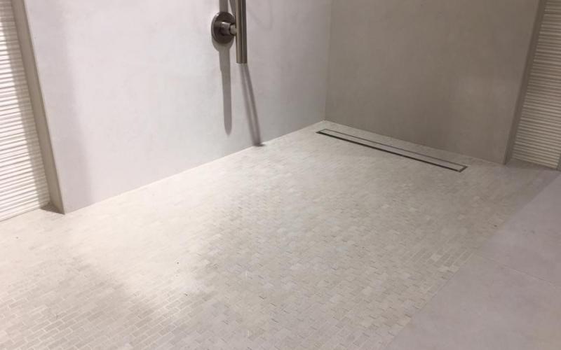 A shower tray made of mosaic tiles in a bathroom in vicenza