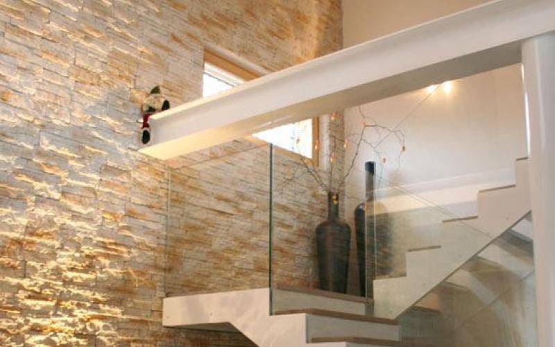 Stone cladding in staircase area inside house