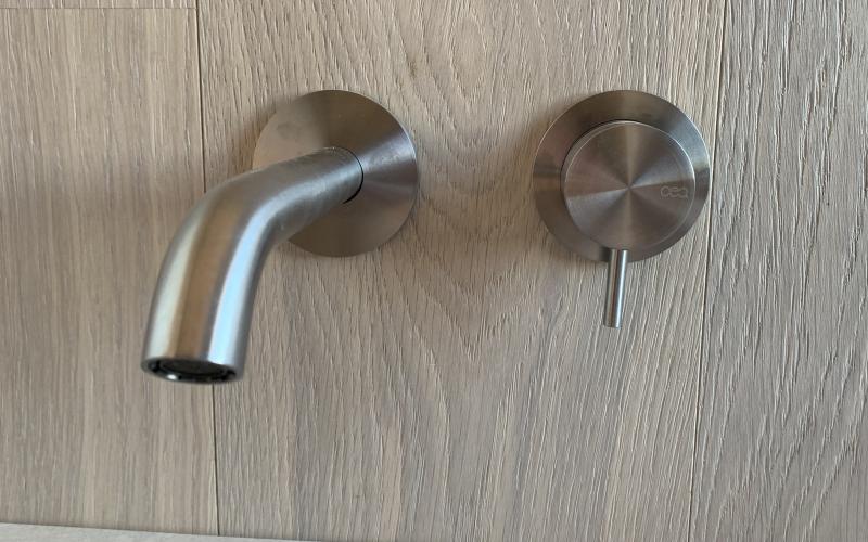 Steel taps for a modern bathroom in Vicenza